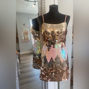 Sequin party dress. Adjustable spaghetti strap w/back zipper closure. Small 0-4